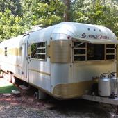 1973 Silver Streak Continental in a wooded setting
