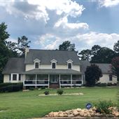 Tropical River’s Edge with Country Porch