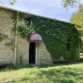 Ivy Covered Stone Building on Country Road