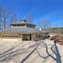Custom built, all glass, hexagon home on 80 acres!
