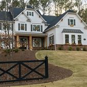 Modern open farmhouse with woods, pool, and bar