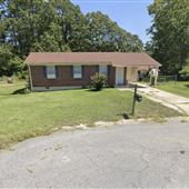 Ranch style brick home with large yard