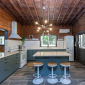 Mid century modern cabin on a pond