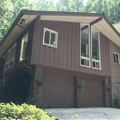 1969 Mid-century / Contemporary on heavily wooded acre lot with creek