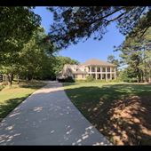 Charming Equestrian Estate with New Orleans Style Home, elegant French details, & sprawling pastures.