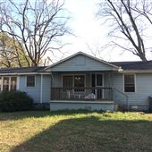 11 acre Old junkyard with house, shop, pond, creek, old vehicles and buses