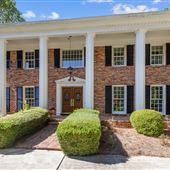 White Columns & Red Brick Traditional Home