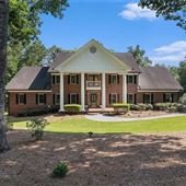 Expansive four-sided brick Colonial-style estate