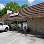 Old shopping strip center and deli market in Tyrone