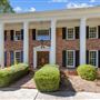 White Columns & Red Brick Traditional Home