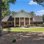 Expansive four-sided brick Colonial-style estate